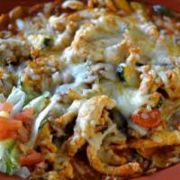 Arroz Con Pollo · Strips of chicken breast sautéed with mushrooms, carrots, onion, celery, and zucchini simmer...
