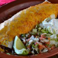 Fajita Burrito · An extra large flour tortilla filled with choice of beef fajita or chicken fajita. Also fill...