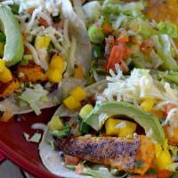 Grilled Fish Tacos · Corn tortillas, fish, avocado, cabbage, pico de gallo, cheese, and cilantro mango sauce.