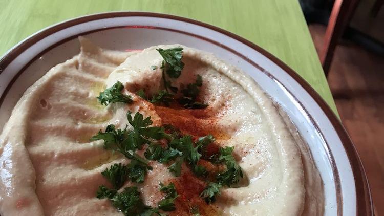 Humus · A creamy blend of garbanzo beans, fresh garlic, tahini, lemon juice, and olive oil. Served with homemade pita bread.