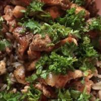 Majadra · Brown lentils and rice simmered with sauteed onions in our secret spices and served with a s...