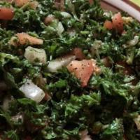 Fattoush Salad · Crisp romaine lettuce, tomato, cucumber, onion, parsley, garlic, lemon juice, and olive oil....