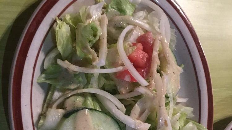 Chicken Salad · Tender marinated chicken on a bed of lettuce with tomato, cucumber, onions, and parsley in house dressing.