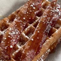 Bourbon Maple Bacon · Our waffle topped with two strips applewood smoked bacon & a side of pure organic maple syru...