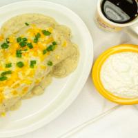 Cowboy · chicken fried steak with three scrambled eggs, cheddar jack cheese, smothered with housemade...