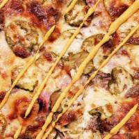 Cubano Pizza · Swiss Alfredo base, Bourbon Smoked Ham, Pulled Pork, Dill Pickles, finished with Yellow Must...