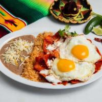 Chilaquiles & Eggs Plate · Choice of red or green sauce poured over crisp fried corn tortilla chips topped with cheese ...