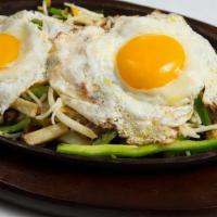 Breakfast Skillet · Two prepared eggs over grilled peppers and onions, breakfast potatoes, choice of chicken or ...