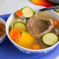 Caldo De Rez · Beef shank and vegetable soup served with a side of rice and choice of corn or flour tortillas