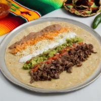 Loaded Burrito · Choice of Meat rolled up with rice, beans, cheese, guacamole, sour cream, and pico de gallo ...