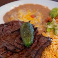Carne Asada · Thin slices of steak grilled to your liking. Served with pico and guacamole. **We continue t...