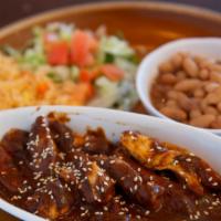 Mole Poblano · Chicken breast slices sauteed in butter and finished with a mole from Puebla. Sprinkled with...