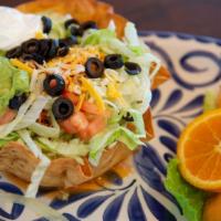 Taco Salad · A crispy flour tortilla bowl with choice of chicken, beef or picadillo. Topped with lettuce,...