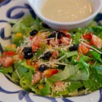 Ensalada Jardin · Crisp Romaine, tomatoes, avocado, corn, red pepper, olives, and topped with shredded parmesa...