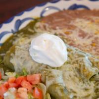 Spinach Enchiladas · Two corn tortillas stuffed with sauteed spinach, mushrooms, onions, and light cream sauce. C...