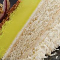 Passion Fruit Layered Cheesecake With Fair Trade Coconut · Layered tangy passion fruit cheesecake and sweet, moist coconut cake on a graham cracker cru...
