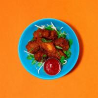 Hot Wings · Six spicy chicken wings.