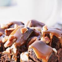 Rockslide Brownie · A light textured Brownie topped with butter-luscious caramel, piled high with Brownie cubes,...