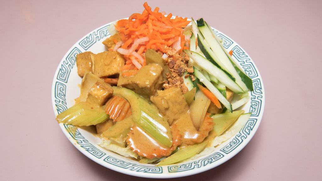 Bún Đậu Hũ Cà Ri · Curry tofu served with rice vermicelli noodle and fresh vegetables.