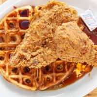 Chicken & Waffle · Fried drumstick and boneless breast with a waffle and syrup.