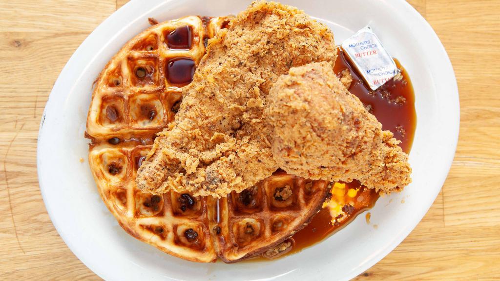 Chicken & Waffle · Fried drumstick and boneless breast with a waffle and syrup.