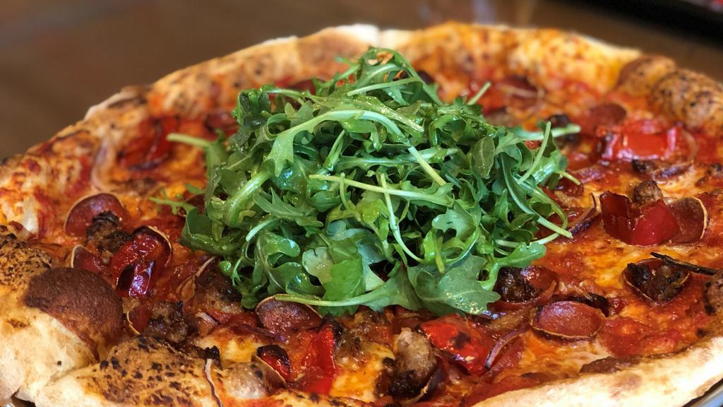 Italian · Aged Provolone, Pepperoni, Italian Sausage, Red Onion, Mama Lil's Peppers topped with Arugula