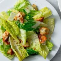 Caesar Salad · Romaine lettuce, Parmesan, torn croutons & Caesar dressing.