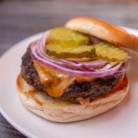 Cheeseburger Bagel · Half pound certified Angus beef, cheddar cheese, sweet spread, pickle, chips, and onions