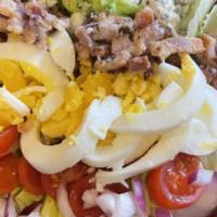 Cobb Salad - Delivery · Iceberg Lettuce, Bacon, Red Onion, Boiled Egg, Cherry Tomatoes, Blue Cheese Crumbles and Blu...
