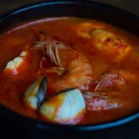 Seafood Tofu Soup (해물 순두부) · Spicy soup with soft tofu, clams and shrimp. Comes with rice and side dishes.