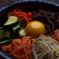 Bibimbap (비빔밥) · Rice with an assortment of zucchini, carrots, beansprouts and radish, and an egg on top. You...