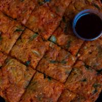 Kimchi Pancake (김치전) · Pancake made with kimchi, onions and green onions. Comes with side dishes.