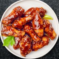 Hot Glaze Honey Wings · Breaded or naked fresh chicken wings, fried until golden brown, and tossed in honey & hot sa...