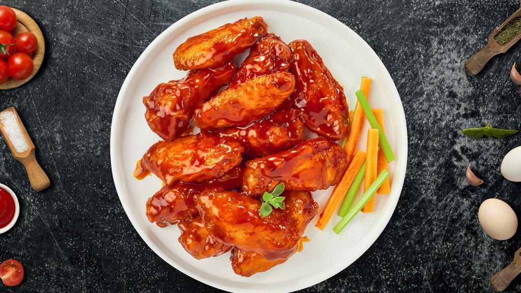 Buffalo Flame Wings · Breaded or naked fresh chicken wings, fried until golden brown, and tossed in buffalo sauce. Served with a side of ranch or bleu cheese.