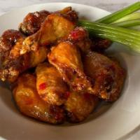 Chicken Wings · One full pound of wings tossed in buffalo, teriyaki, sweet chili or a spicy cajun rub.