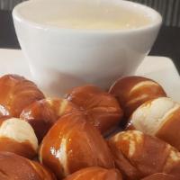 Pretzel Bites · Warm soft pretzels served with queso blanco.