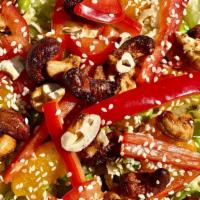 Asian Cashew · Romaine, cabbage, cashews, edamame, red peppers, and mandarin oranges with Asian sesame dres...