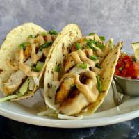 Grilled Chicken · Two tacos topped with a cilantro-lime cabbage mix, green onion, and chipotle aioli.