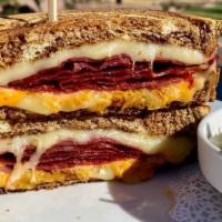 Classic Reuben · Sliced corned beef with sauerkraut, 1000 island and swiss on grilled marbled rye.