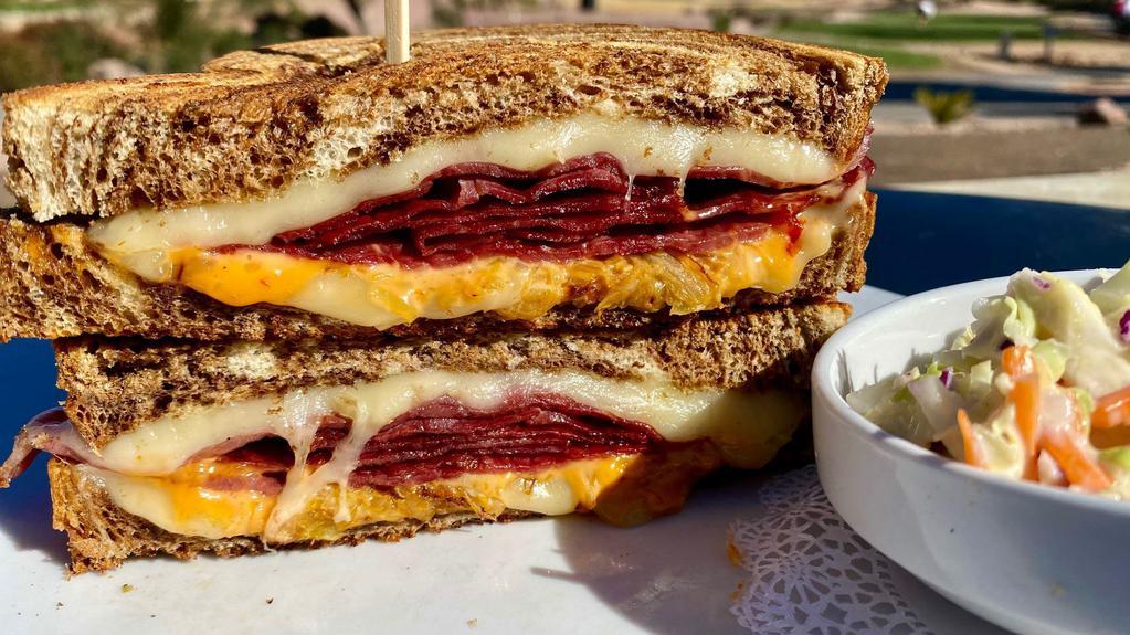 Classic Reuben · Sliced corned beef with sauerkraut, 1000 island and swiss on grilled marbled rye.