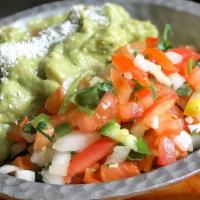 Guacamole Dip · Our perfect recipe made with ripe avocados, lime, cilantro, tomatoes, onions, jalapenos, cot...