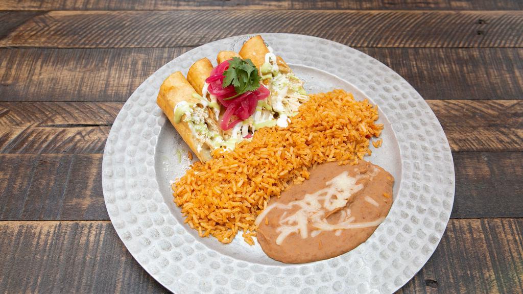 Flautas Plate · Flour tortillas filled with shredded chicken or shredded beef with melted jack cheese served with crema and mexican avocado crema