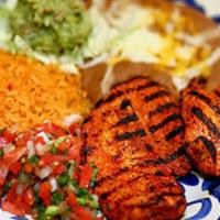 Pollo A La Parrilla · Chicken breast marinated in mexican spices with guacamole, pico de gallo, tortillas