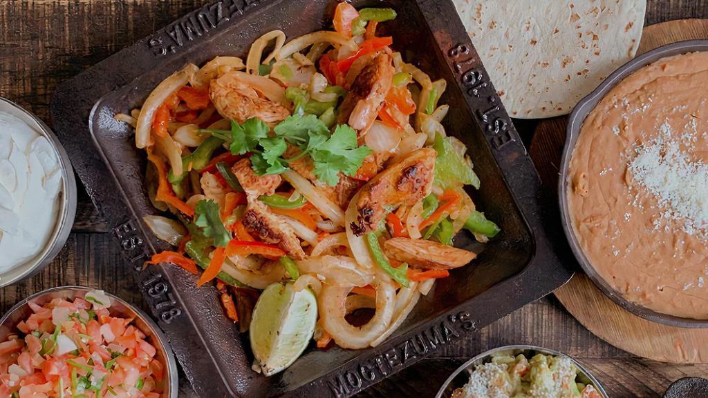 Fajitas Platter · A platter for 10 guest. Steak or chicken fajitas with tortillas. Includes rice, beans, guacamole, and sour cream.