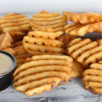 Waffle Fries · Seasoned Waffle fries served with one complimentary dipping sauce of your choice.