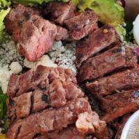 Steak & Spinach Salad  · Spinach, Blue Cheese Crumble, Red Onion, Bacon, Tomato, Avocado, 5 oz Tenderized Steak, and ...