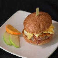 Breakfast Burger · 100% grass-fed beef patty, fried egg, bacon, cheese, caramelized onions, hostel sauce