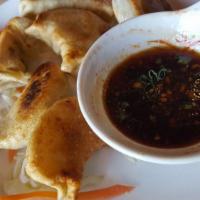 Chef Mok'S Pork Dumplings · Flavored pork and vegetables wrapped in chef mok's dumpling dough. Can be prepared pan-fried...