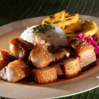 Lechon Kawali · Braised pork belly then deep fried. Served with Mang Thomas sauce, white rice, vegetable sla...