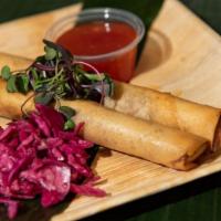 (2) Large 10” Lumpia Shanghai (Eggroll) · Ground beef, minced carrots, garlic, sweet onion. Served with sweet chili, rice and seasonal...